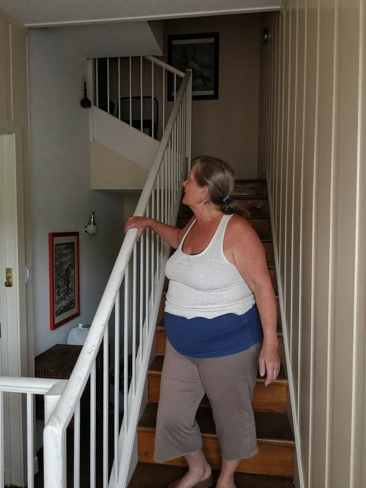 Pausing at the bottom of a staircase