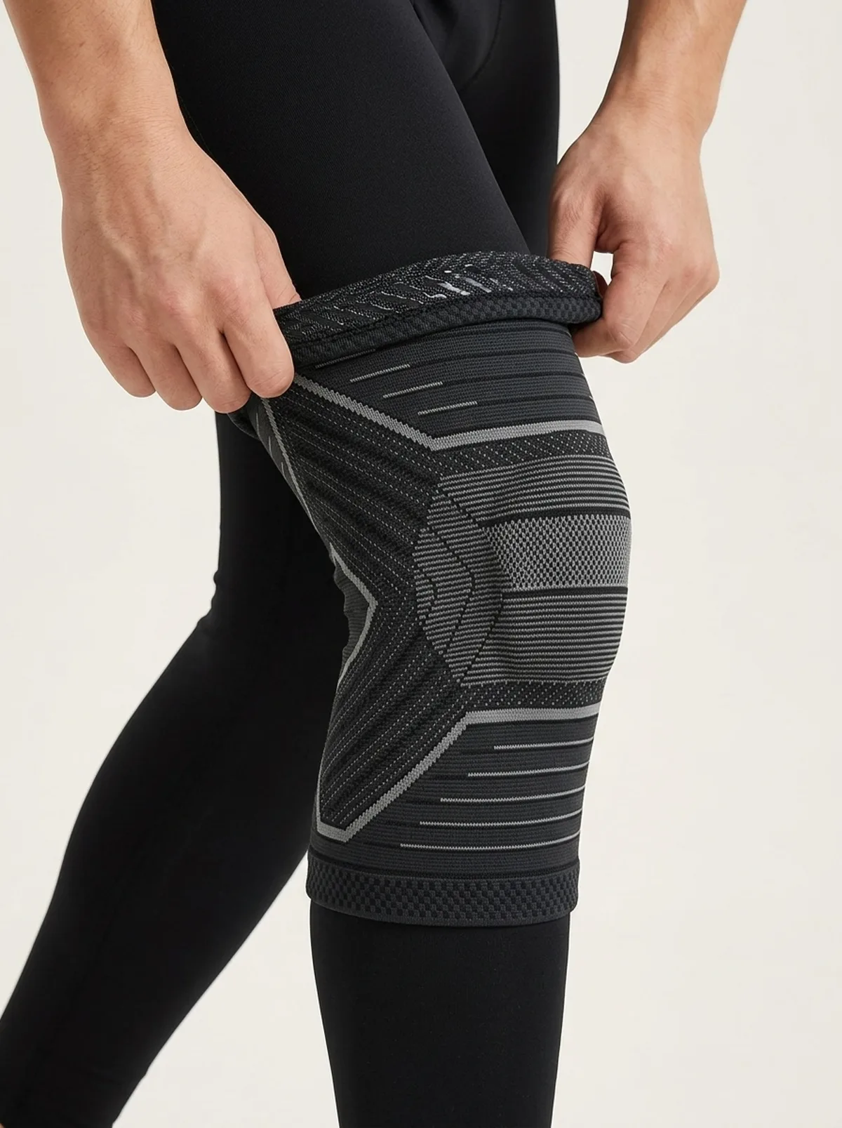 Sliding the knee sleeve up over the knee