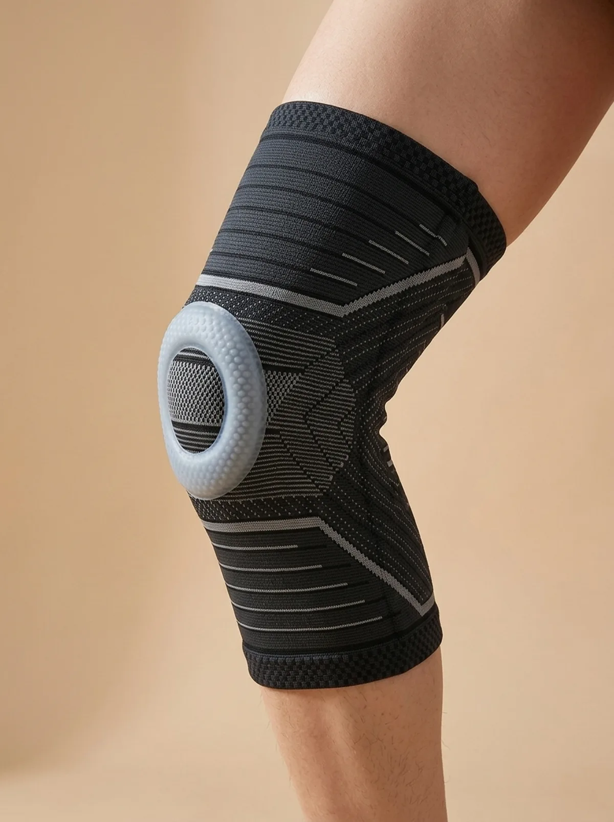 The Everly knee sleeve worn, showing the knit fit and the patella ring